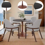 Cette table à manger ronde, dotée d'un plateau en panneau de fibres de moyenne densité et d'un piètement en acier couleur cerise, est une table d'appoint moderne adaptée aux cuisines, aux salles à manger et aux petits espaces.